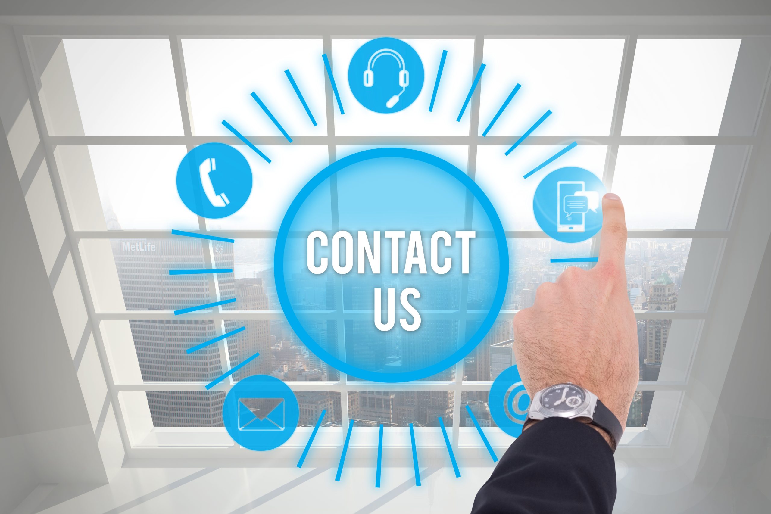 composite of hand pointing at graphics with city background